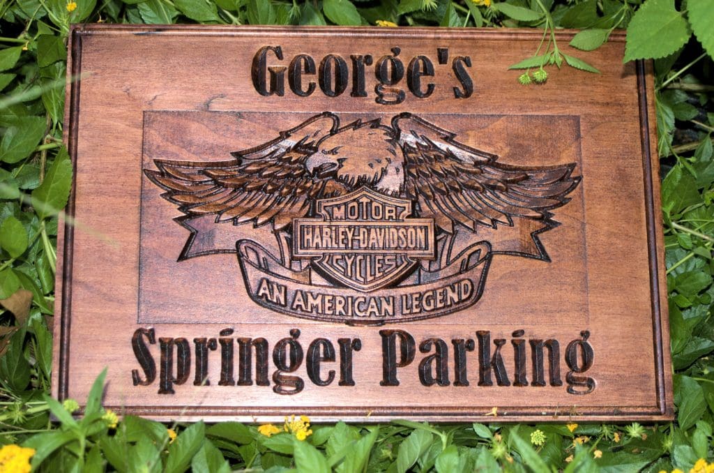 George's Springer Parking with carved Harley-Davidson logo.